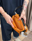 topologie bottle sacoche medium burn orange ripstop and utility sling black